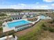 An aerial view of the community pool and recreational areas, perfect for outdoor fun and relaxation at 14786 Horse Trot Rd, Lithia, FL 33547