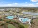 Aerial view of Hawkstone community, highlighting resort-style pools and surrounding amenities at 14786 Horse Trot Rd, Lithia, FL 33547
