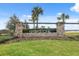 Community entrance to Hawkstone featuring a stone sign and well manicured landscaping at 14786 Horse Trot Rd, Lithia, FL 33547