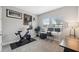 Bright exercise room with natural light and features exercise bike at 14786 Horse Trot Rd, Lithia, FL 33547