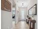 Bright hallway with wood-look tile flooring and access to living spaces at 14786 Horse Trot Rd, Lithia, FL 33547