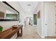 Inviting hallway with wood-look tile flooring and stylish decor at 14786 Horse Trot Rd, Lithia, FL 33547