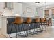 Stylish kitchen island with seating and modern pendant lighting at 14786 Horse Trot Rd, Lithia, FL 33547
