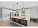 Modern kitchen featuring a large island, stainless steel appliances, and white cabinetry at 14786 Horse Trot Rd, Lithia, FL 33547