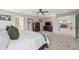 Bright Primary bedroom with carpet flooring, neutral walls, and a glimpse into the connecting living room at 14786 Horse Trot Rd, Lithia, FL 33547