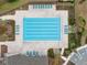 Overhead view of the community pool with lounge chairs, parking spaces, and landscaping at 14786 Horse Trot Rd, Lithia, FL 33547