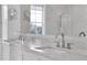 Bathroom vanity with double sinks, large mirror, and contemporary chrome faucets at 200 Cordova Ne Blvd, St Petersburg, FL 33704