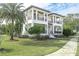 Elegant two-story estate home featuring meticulously manicured lawn, lush landscaping and stately covered balconies at 200 Cordova Ne Blvd, St Petersburg, FL 33704