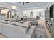 Bright living room featuring an open concept with a kitchen view and gray decor at 200 Cordova Ne Blvd, St Petersburg, FL 33704