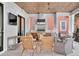Outdoor kitchen with grill, countertop, seating, and a mounted television at 200 Cordova Ne Blvd, St Petersburg, FL 33704