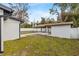 Backyard showing a covered patio with walkway on grass at 4420 Pompano Se Dr, St Petersburg, FL 33705