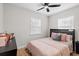 Cozy bedroom with hardwood floors, modern ceiling fan, and natural light at 4420 Pompano Se Dr, St Petersburg, FL 33705