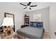 Bedroom with hardwood floors, fan, and a bookshelf at 4420 Pompano Se Dr, St Petersburg, FL 33705