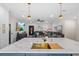 Modern kitchen with island, gold accents, with an open view to the living room, and featuring stainless appliances at 4420 Pompano Se Dr, St Petersburg, FL 33705