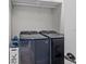 Laundry room with front loading washer and dryer and a white wire basket at 4420 Pompano Se Dr, St Petersburg, FL 33705