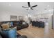 Open-concept living room flowing into the kitchen with a bar and seating, perfect for entertaining at 4420 Pompano Se Dr, St Petersburg, FL 33705