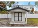 Backyard shot of shed with black door trim and black roof trim at 4420 Pompano Se Dr, St Petersburg, FL 33705