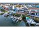 Aerial view featuring a waterfront home's backyard, multiple docks, and boat lifts ready for aquatic adventures at 861 Symphony Isles Blvd, Apollo Beach, FL 33572
