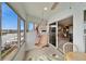 Relaxing screened balcony with a hammock, overlooking waterfront views and flooded with natural light at 861 Symphony Isles Blvd, Apollo Beach, FL 33572