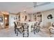 Home bar featuring a counter with seating and decorative display shelves at 861 Symphony Isles Blvd, Apollo Beach, FL 33572