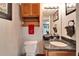 Bathroom with granite countertop and vintage wood cabinet at 861 Symphony Isles Blvd, Apollo Beach, FL 33572