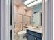 Compact bathroom with a shower/tub, white cabinets, and clean finishes at 861 Symphony Isles Blvd, Apollo Beach, FL 33572