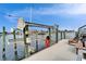 A side view of the boat lift and surrounding neighborhood at 861 Symphony Isles Blvd, Apollo Beach, FL 33572