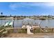 An inviting waterfront view with a dock, boat lift and waterfront neighborhood at 861 Symphony Isles Blvd, Apollo Beach, FL 33572