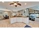 Open-concept kitchen with granite countertops, tile flooring, and seamless flow to the dining and living areas at 861 Symphony Isles Blvd, Apollo Beach, FL 33572