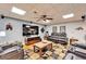 Comfortable living room with a flat-screen TV, a ceiling fan, and leather seating, perfect for relaxation at 861 Symphony Isles Blvd, Apollo Beach, FL 33572
