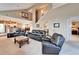 Spacious living room with high ceilings, comfortable seating, and open access to kitchen and dining areas at 861 Symphony Isles Blvd, Apollo Beach, FL 33572