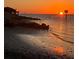 Sunset on the bay with city skyline at 861 Symphony Isles Blvd, Apollo Beach, FL 33572