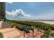 Scenic beach access with lush vegetation, lounge seating and stunning ocean views at 1520 Gulf Blvd # 1404, Clearwater Beach, FL 33767