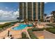 Stunning swimming pool with lounge chairs and umbrellas, providing a resort-style experience at 1520 Gulf Blvd # 1404, Clearwater Beach, FL 33767