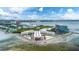 Aerial view showcases the waterfront condo complex with water views and city skyline in the distance at 2506 N Rocky Point Dr # 272, Tampa, FL 33607