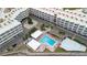 Aerial view of complex with swimming pool, parking, and landscaping at 2506 N Rocky Point Dr # 272, Tampa, FL 33607