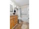 A clean and modern bathroom features tile flooring and a shower/tub combo at 2506 N Rocky Point Dr # 272, Tampa, FL 33607