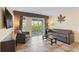 Inviting living room with comfortable seating, a balcony with an outdoor seating area and scenic views at 2506 N Rocky Point Dr # 272, Tampa, FL 33607