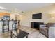 Cozy living room featuring modern furnishings, tile flooring, and a view of the water at 2506 N Rocky Point Dr # 272, Tampa, FL 33607