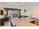 Open-concept living area featuring a kitchen bar, dining area, and a comfortable living room at 2506 N Rocky Point Dr # 272, Tampa, FL 33607