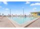Inviting outdoor pool area with lounge chairs and umbrellas at 2506 N Rocky Point Dr # 272, Tampa, FL 33607