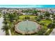 An aerial view of a community basketball court surrounded by lush landscaping at 6834 Blue Moon Way, Sun City Center, FL 33573