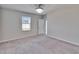 Bright bedroom with large window, neutral paint, and carpet flooring at 6834 Blue Moon Way, Sun City Center, FL 33573