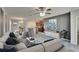 Open concept living space featuring modern furnishings, hardwood cabinets, tile floors, and a neutral color palette at 6834 Blue Moon Way, Sun City Center, FL 33573