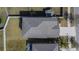 Aerial shot of a well-maintained gray roof with modern shingles, gutters, and ventilation for efficient water runoff at 6834 Blue Moon Way, Sun City Center, FL 33573