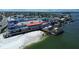 Waterfront restaurants on a pier with boats, with stunning views of the surrounding water and cityscape at 6950 113Th St, Seminole, FL 33772