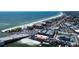 Beautiful aerial view of beach and town with vibrant waterfront restaurants and clear ocean views at 6950 113Th St, Seminole, FL 33772