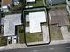 Aerial view of a home with a fenced yard, concrete driveway, and well-maintained landscaping at 6950 113Th St, Seminole, FL 33772