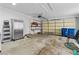 A spacious garage with abundant storage and door to backyard and overhead garage door at 6950 113Th St, Seminole, FL 33772