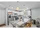 Beautiful kitchen with granite countertops, stainless steel appliances, island seating, and ample cabinet space at 6950 113Th St, Seminole, FL 33772